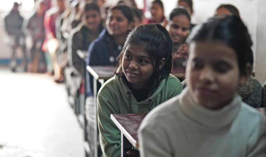 Classroom of girls sitting at desk - The Soondra Foundation